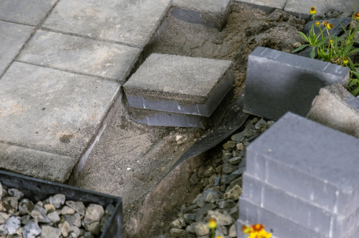Broken concrete pavers needing repair in Alexandria, VA