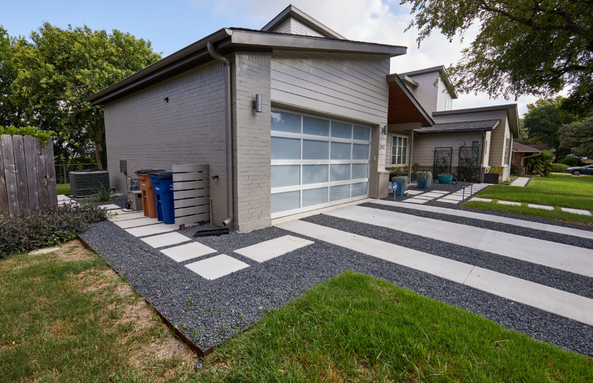 Modern concrete driveway with gravel accents in Alexandria, VA
